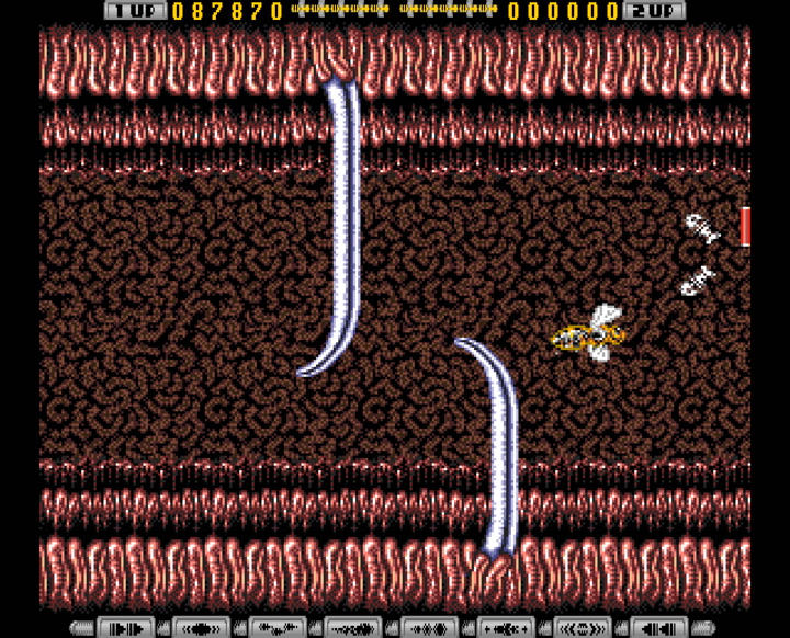 Apidya (1992, Amiga) - in-game screenshot showing the bee protagonist and enemy formations